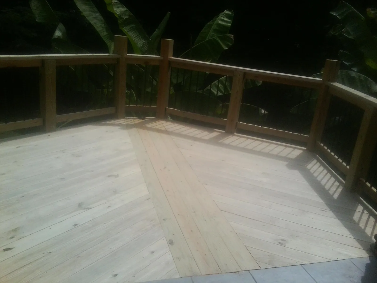 New wood deck and railing built off the back of a home in Langeloth